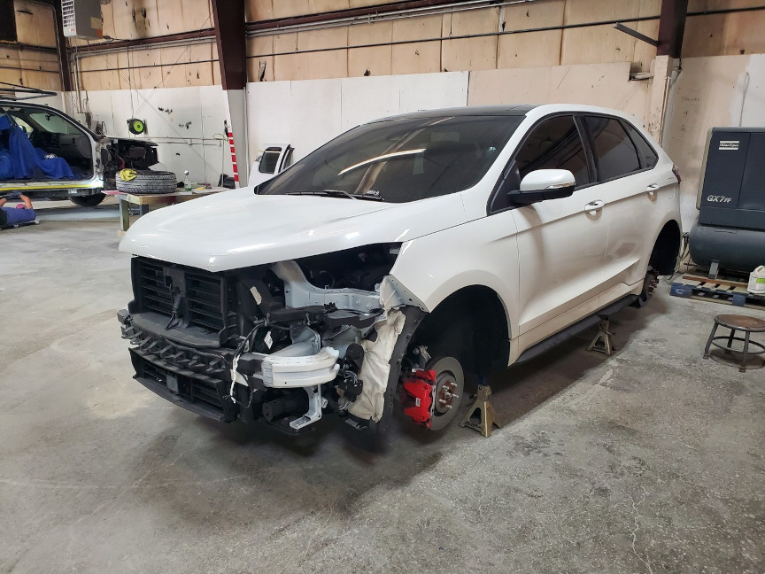 Image of car wreck with front end collision repair damage